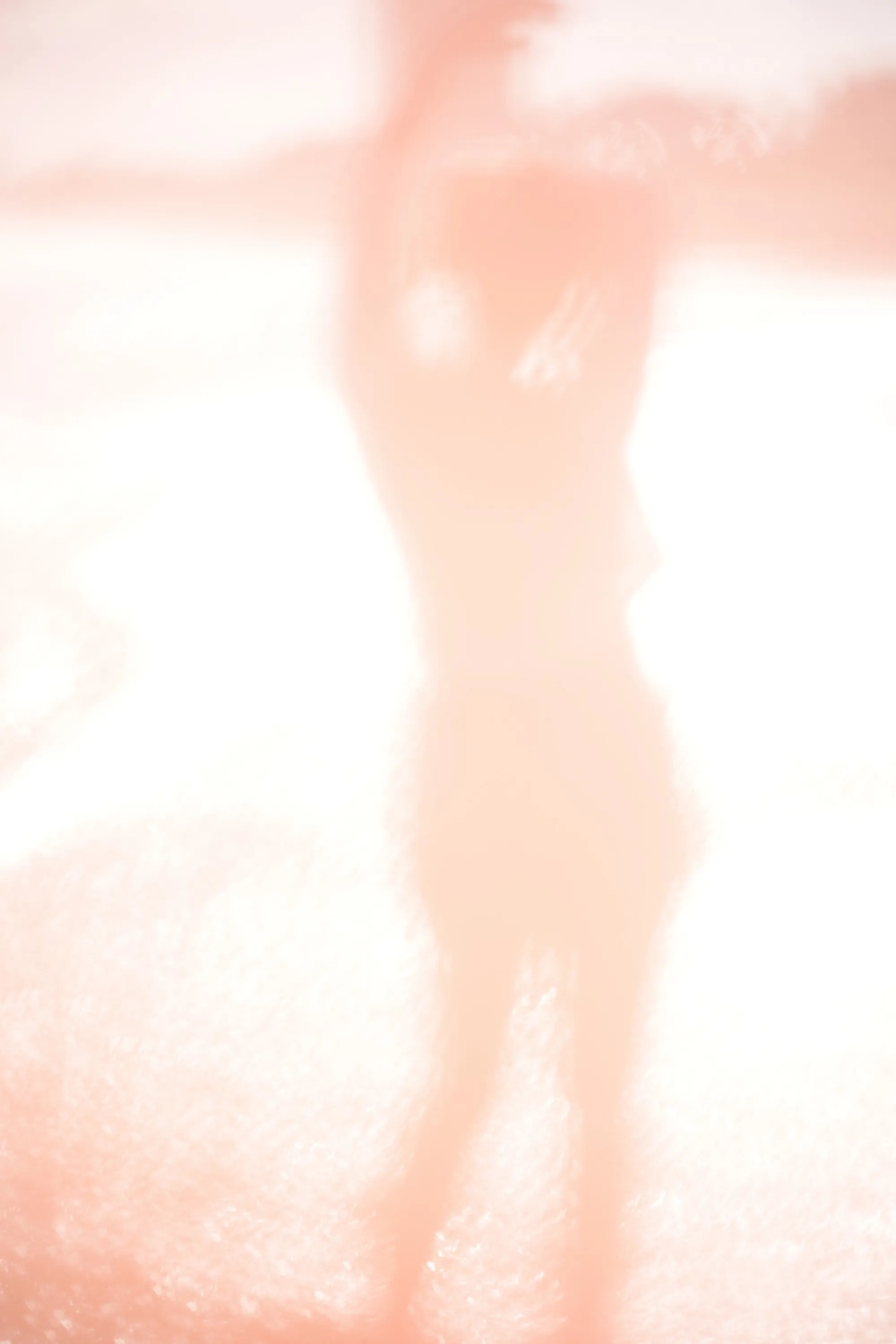 Overexposed pastel portrait by the shore — lace, sand and backlight — 9